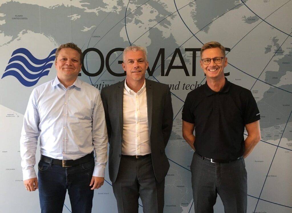 A group photo of Hans Jensen, Rasmus Hansen, and the then Head of EURONAV, all smiling and posing in front of the camera