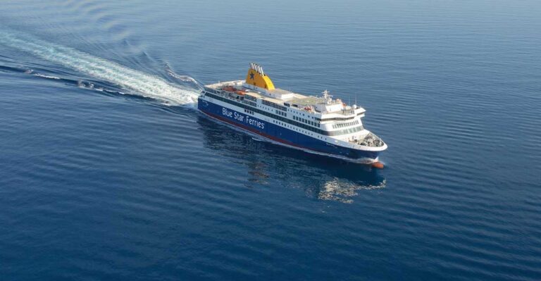 A wide shot of a passenger ship cutting through the sea at great speed
