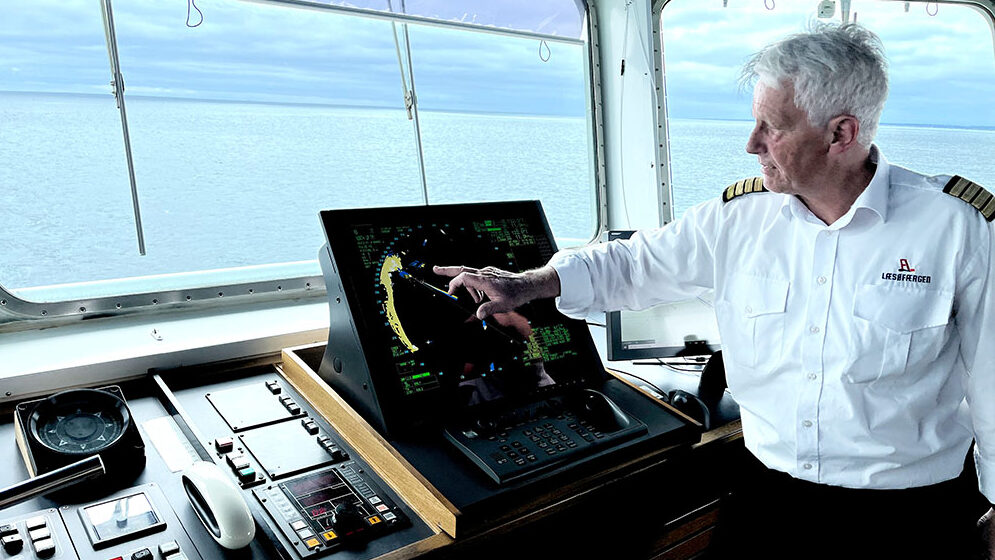 A picture of Allan Hjortnæs Pedersen, Chief of Maintenance at Læsøfærgen, standing on the bridge of the vessel