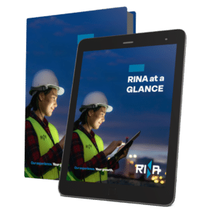 A mockup featuring a book and a tablet, both displaying the cover of 'RINA at a GLANCE.'