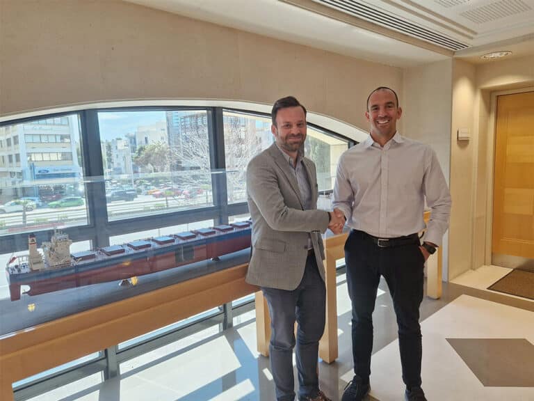 A picture of Dimitiris shaking hands with Michalis Kontaratos from Pantheon tankers