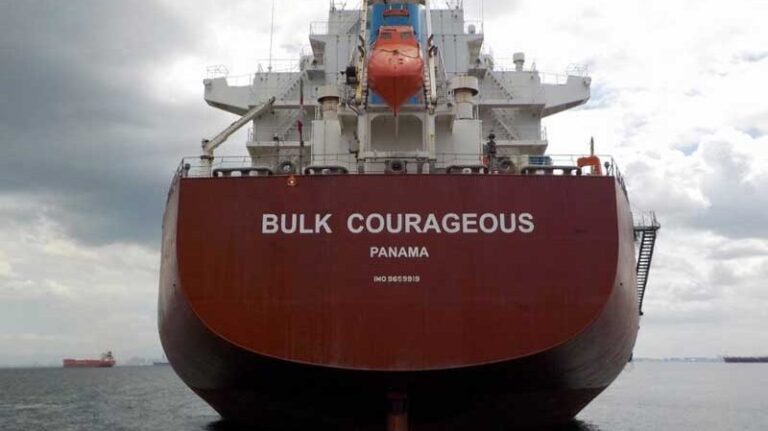 A close-up of the stern of a bulk vessel at sea