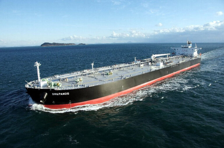 A World Tankers Management Pte Ltd. tanker cruising across calm waters under a clear blue sky